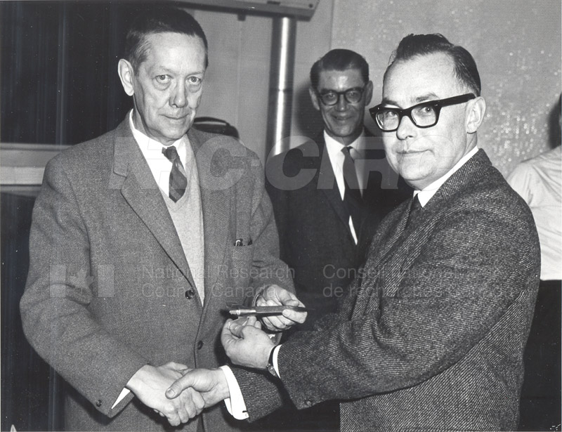 Presentation of Firing Key Memento by J.H. Brady to W.L. Haney to Commemorate the Launching of First Canadian Rocket under NRC Sponsorship March 1966