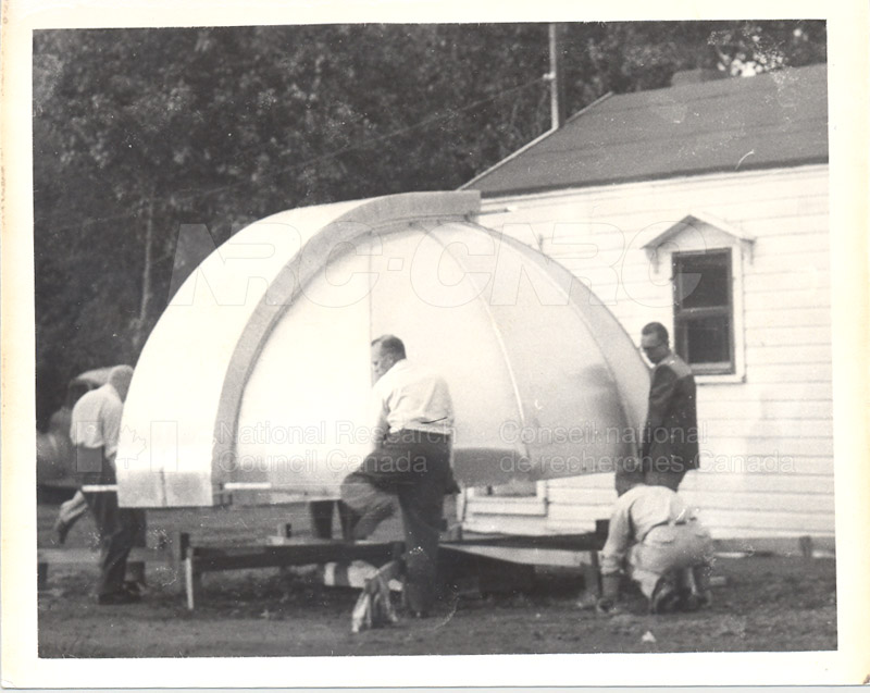 Sutters Installed- The Dome Being Lifted from the ''Spider'' by J.C. Hodges, Bull Kinsman, John Down, Gordon Armstrong July 1954